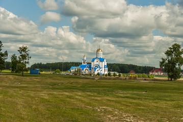 Church against the blue sky and beautiful clouds 