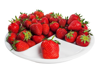 Heap of ripe juicy strawberry on plate isolated