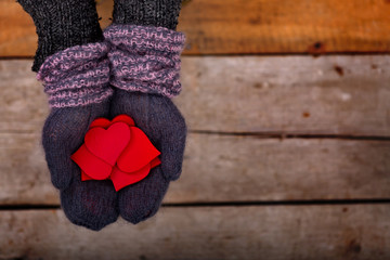 many red hearts in hands