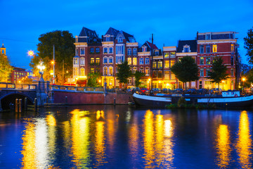 Fototapeta premium Amsterdam city view with Amstel river