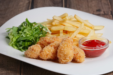 chicken in breading with french fries and green salad