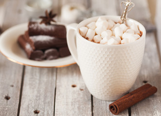 Chocolate dessert and mug of cacao