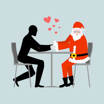 Christmas Lover. Lovers in cafe. Man and Santa Claus sitting at