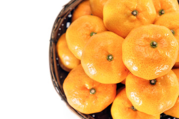Oranges / View of heap of oranges in wooden container. Top view.