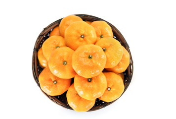 Oranges / View of heap of oranges in wooden container. Top view.