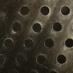 Perforated metal surface, textured background