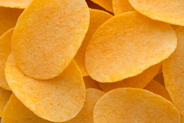 Close up potato chips on wood top view background.