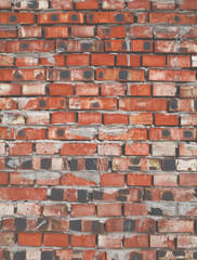 Textured wall made of red baked bricks