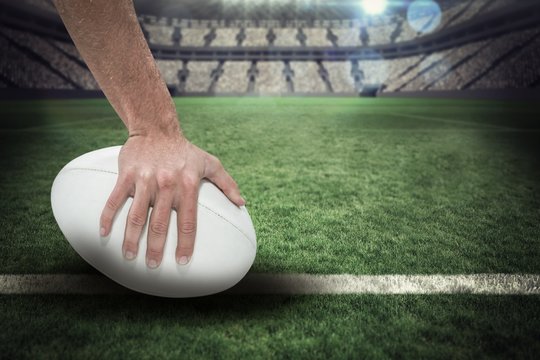 Composite image of close-up of sports player holding ball 3D