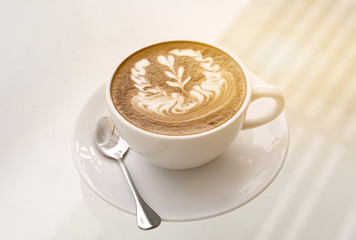 Glass of coffee on table,warm toned