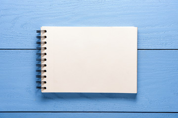 paint book on blue table background