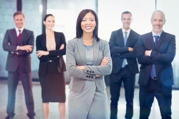 Portrait of business people standing with arms crossed