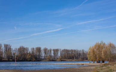 Beautiful blue sky with facile clouds end of november over River Rhine (close to Dusseldorf / Germany)