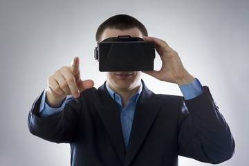 Young businessman uses a virtual reality glasses