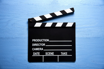 Obraz premium Clapper board,Movie clapper on blue wood backgrond