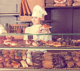 Girl cook gladly suggesting pastry