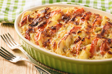Potato casserole with tomatoes, garlic and cheese.