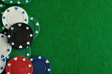 Poker chips forming a border with a green background