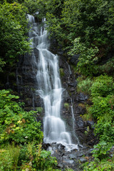 Small Waterfall Near Valdez Lake in Alaska Surrounded by Green T