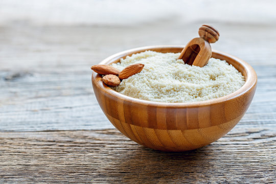 Wooden bowl with almond flour.