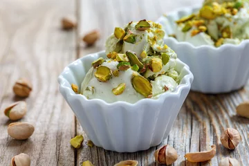 Gordijnen Homemade ice cream with pistachios in ceramic bowls. © sriba3