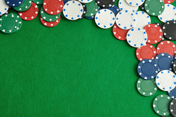 Poker chips forming a border with a green background