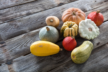 group of autumn colorful organic vegetables over genuine old wood