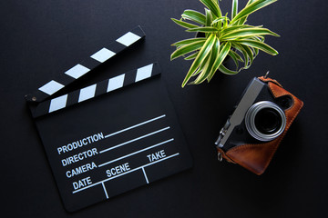 Clapper board,Movie clapper and camera on dark background