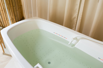 Empty jacuzzi, tub filled with water in the spa
