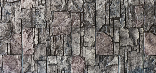 a wall of rough weathered decorative stones