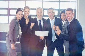 Team of businesspeople with certificate