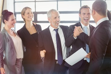 Team of businesspeople with certificate