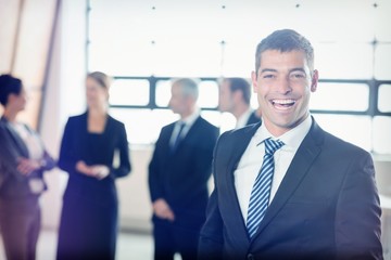 Portrait of excited young businessman