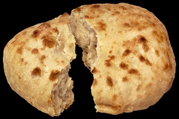 Pitta Bread Loaf Torn In Half Isolated On Black Background