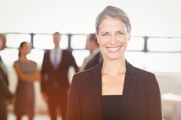 Attractive businesswoman smiling at camera