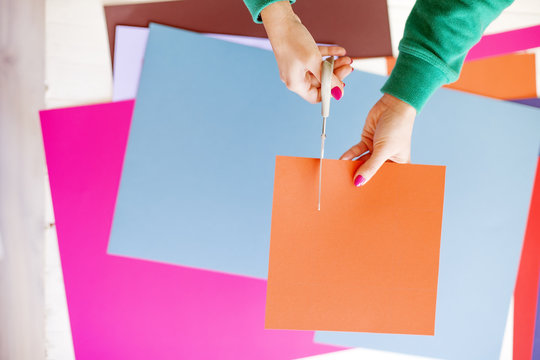 Young woman make scrapbook of the papers on the table using anti