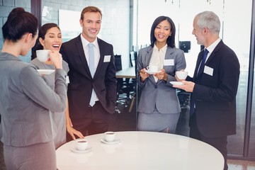 Businesspeople having a discussion during breaktime