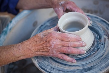 Close-up of potter making pot