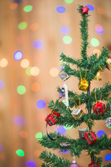 Christmas tree and gift boxes,on bokeh background