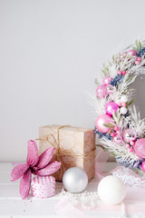 Fototapeta na wymiar Christmas wreath winter holiday door decoration in pink