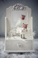 Christmas and New Year decoration.Christmas concept.Toy funny bird on a Christmas background.
