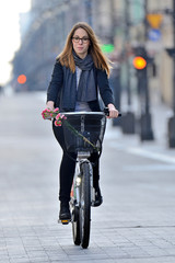 Young woman on a bicycle. © Tomasz Warszewski