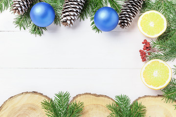 Christmas New Year composition with tangerines, cones, nuts, wicker basket and fir branches in rustic style on old wooden background, selective focus,red bell, , ,