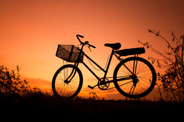 Fototapeta na wymiar Old Bicycle silhouette at sunset, Landscape picture Bike at suns