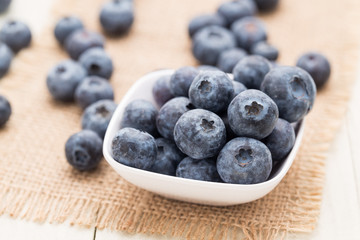 Blueberries in a white cup.