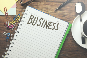 Business text on notebook