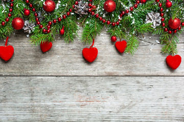 Christmas background with decorations, velvet hearts and fir tre