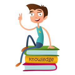 Funny teenage boy sitting on a pile of books and showing two fingers - a sign of Victory.