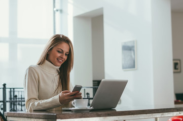 Portrait of beautiful young woman working in the office.