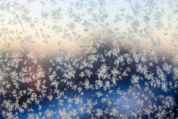 Little frosty patterns on glass, visible snowflakes. Winter in R